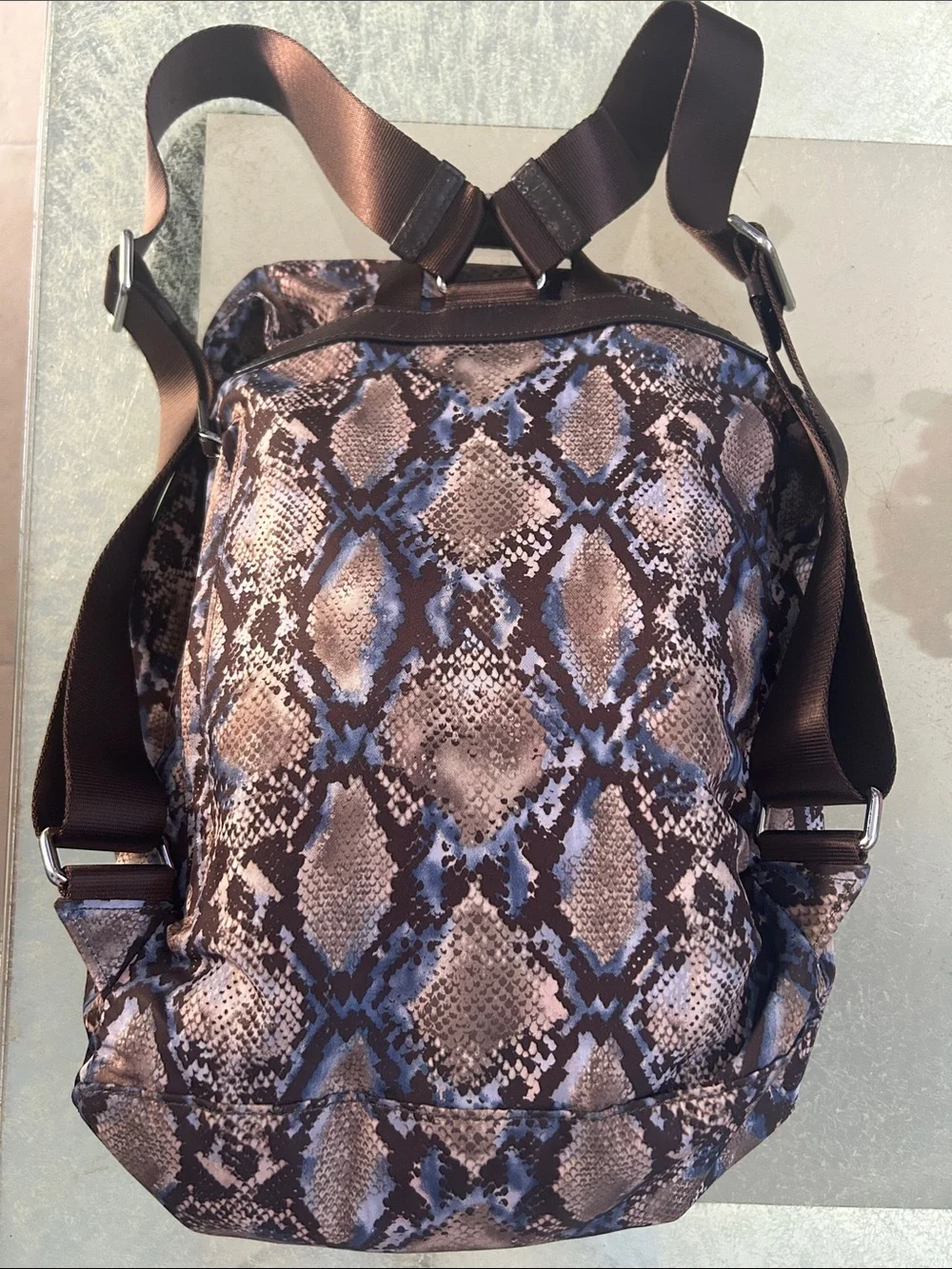 Tumi Snake-Print Backpack in Brown and Blue